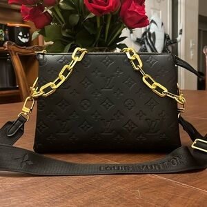 LV leather handbag . New 10 by 8 inches . 3 pocket interior .